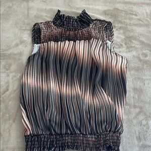 Sleeveless blouse with sparkly thread